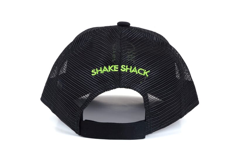 Image of the back side of the team member hat which has the shake shack logo arched over the middle.